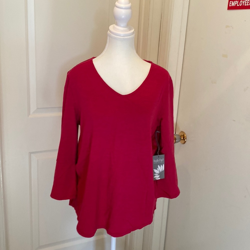 Beautiful top, has 2 pleats in the back.